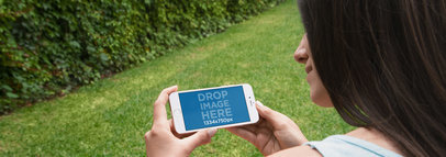 iPhone 6 Mockup Generator of a Brunette at the Garden  a4440