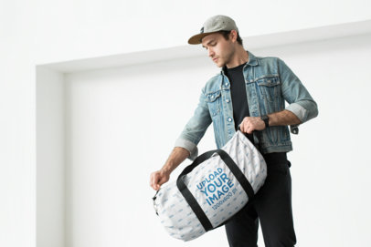 Mockup of a Man Closing His Duffle Bag