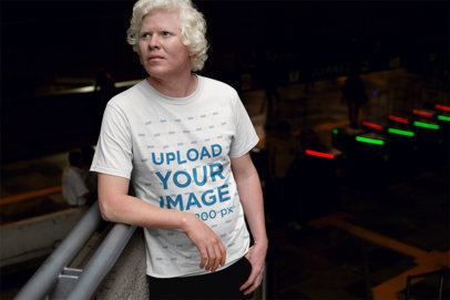 Round Neck T-Shirt Mockup of a Man Leaning Against a Handrail