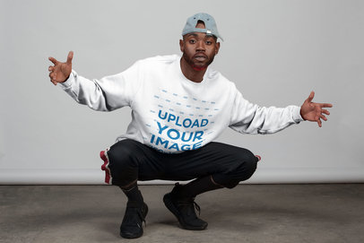 Mockup of a Man Wearing a Sweatshirt Posing with Swag 21673