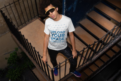 Mockup of a Stylish Man Wearing a Tshirt in a Building Stairway 22292