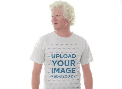 Tshirt Mockup of a Man Wearing a Tshirt Against a Bright Light
