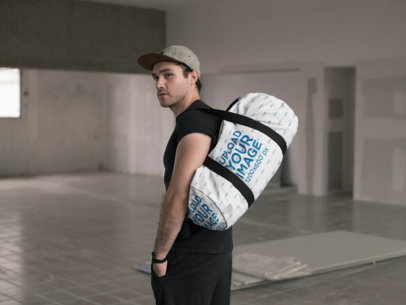 Mockup of a Kit Bag Hanging from a Man's Shoulder