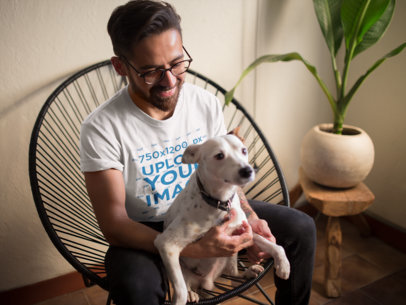 Mockup of a Man Wearing a T-Shirt While Holding His Cute Dog