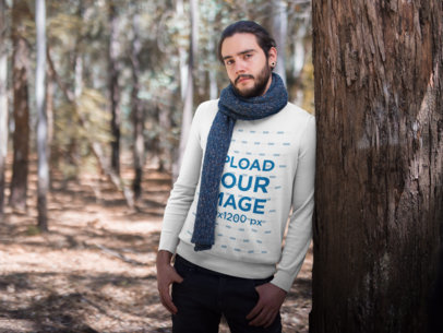 Mockup of a Man Wearing a Sweater and a Scarf while Leaning Against a Tree 18096