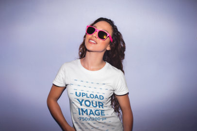 Mockup of a Stylish Woman Wearing a T-Shirt and Bright Pink Sunglasses 22287