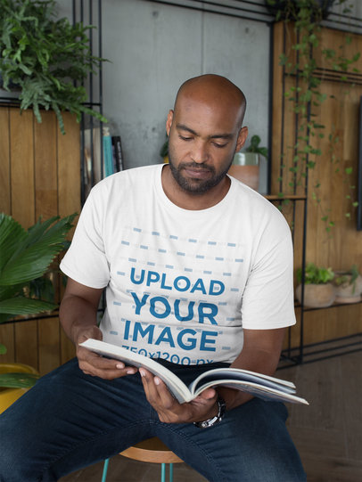 T-Shirt Mockup of a Man Reading a Book