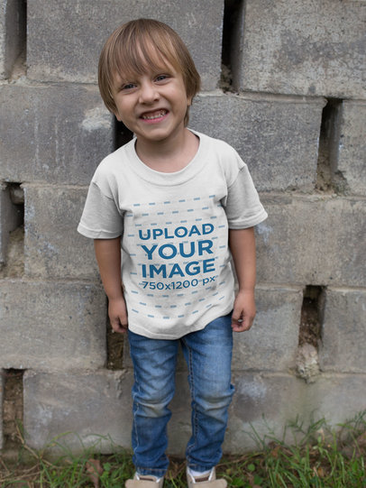 T-Shirt Mockup Featuring a Smiling Little Boy