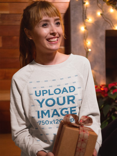Christmas Sweater Mockup of a Woman Holding a Christmas Present