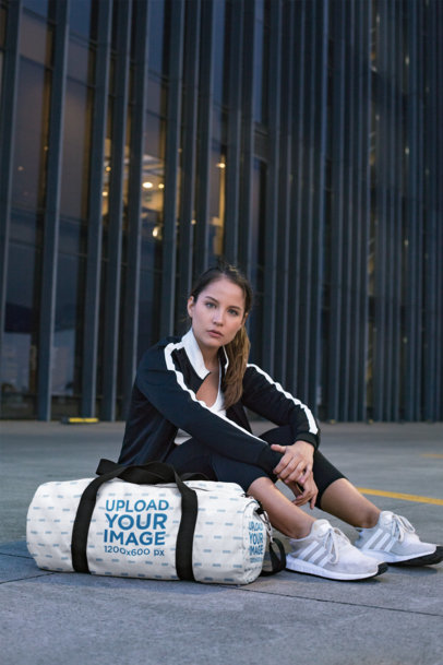 Duffle Bag Mockup Featuring a Serious Young Woman 