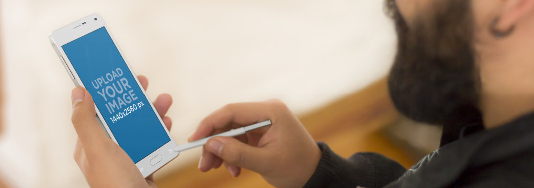 Android Mockup of a Designer Taking Notes With Stylus Pen 