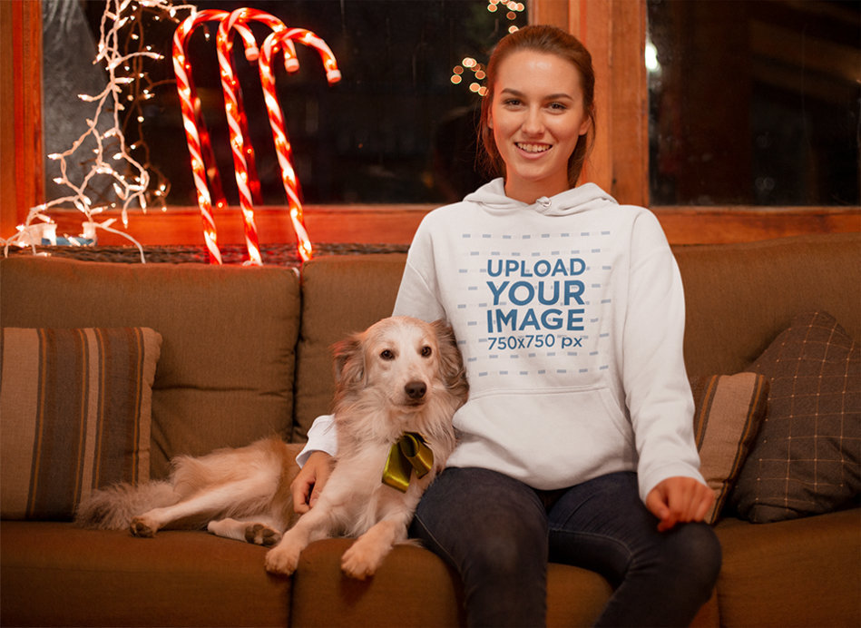 Christmas Hoodie Mockup of a Woman Surrounded by Xmas Ornaments with Her Dog