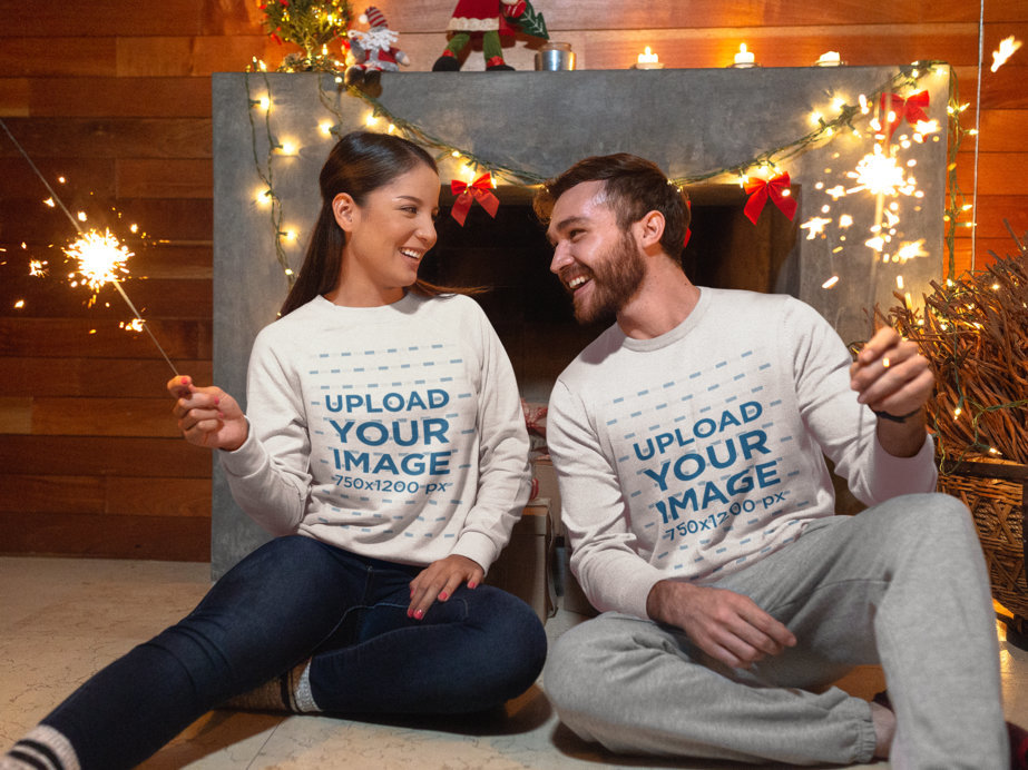 Sweatshirt Mockup of a Couple with Sparklers Celebrating Christmas