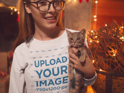 Sweatshirt Mockup of a Woman Cuddling with Her Cat on a Christmas Setting