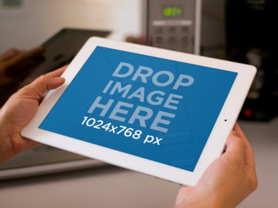 Mockup of a White iPad on Someone's Hands