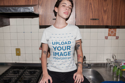 T-Shirt Mockup of a Tattooed Woman in Her Kitchen
