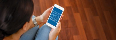 iPhone 6 Mockup Template of a Young Lady at Home