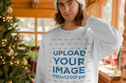Sweater Mockup of a Blonde Man by a Christmas Tree