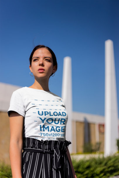 Tee Mockup Featuring a Stylish and Pensive Woman