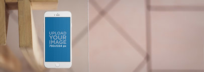 iPhone 6 Mockup Template Over a Glass Table