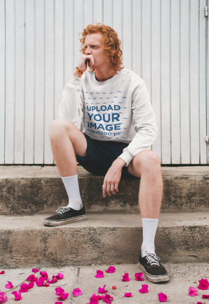 Sweatshirt Mockup of a Man with Red Hair Sitting Pensively
