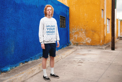 Crewneck Sweater Mockup of a Red-Haired Man in Front of Colorful Walls 21191