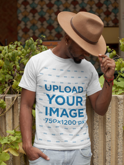 T-Shirt Mockup of a Man Wearing a Felt Western Hat
