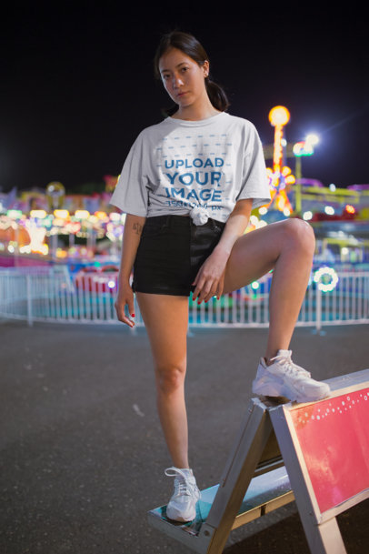 Unisex T-Shirt Mockup of a Woman at the Fairgrounds 22985
