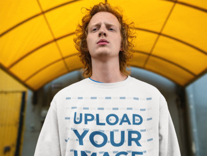 Mockup of a Red-Haired Man Wearing a Sweater Under a Tarp