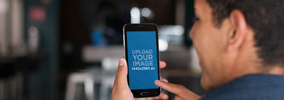 Android Mockup of a Man Using a Samsung Galaxy at a Bar