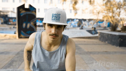 Video of a Young White Man with Mustache Adjusts His Snapback Hat While at a Skatepark 14161