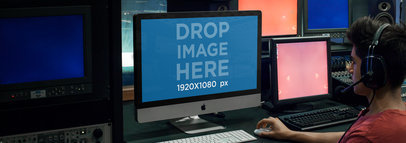 iMac Mockup Featuring a Young Producer at a Music Studio 