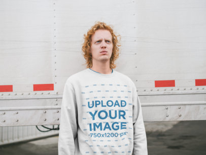 Sweatshirt Mockup of a Serious Man with Red Hair Against a Trailer Truck