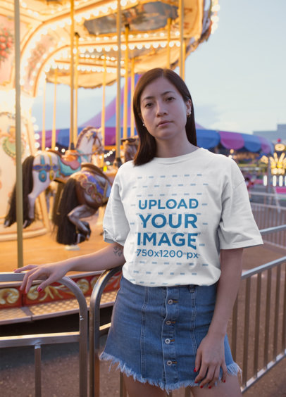 Unisex Tee Mockup Featuring a Pretty Woman Next to a Carrousel 