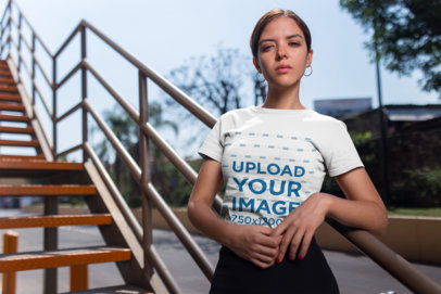 Mockup of a Cool Woman Wearing a Tee on an Industrial Staircase