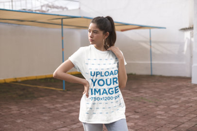 Mockup of a Woman on a Rooftop Wearing a Unisex Tee