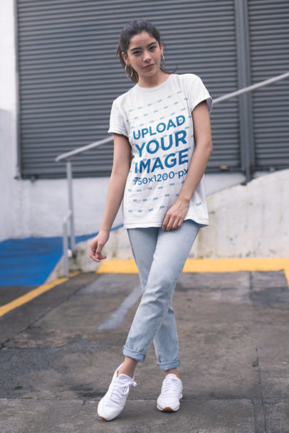 Unisex T-Shirt Mockup of a Woman Outside a Closed Store