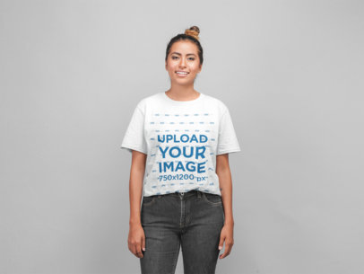 Mockup of a Smiling Woman Wearing a Tshirt in a Photo Studio