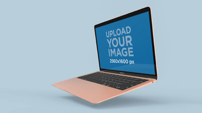Gold MacBook Air Mockup Floating Over a Solid Surface