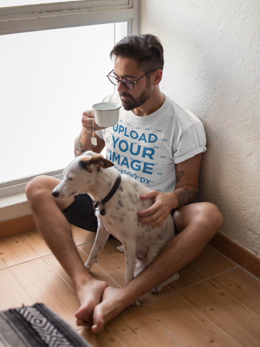 T-Shirt Mockup Featuring a Man Drinking Tea Sitting by his Dog