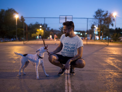 Round Neck Tee Mockup Featuring a Man Playing with his Dog at a Court