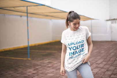 Mockup of a Smiling Woman Wearing a Unisex Tshirt