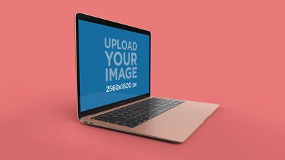 Mockup of a Gold MacBook Air Resting Partially Towards the Right 23680