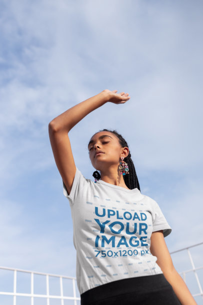 Tee Mockup of a Woman Posing in the Wind 21814