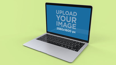 Mockup of a Silver MacBook Air Over a Solid Surface