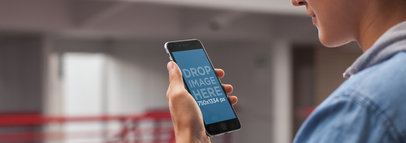 iPhone 6 Mockup Template of a Young Man at School