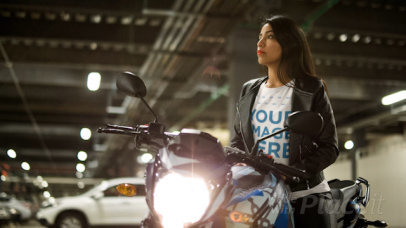 Cinemagraph of a Young Lady Wearing a T-Shirt and a Leather Jacket Sitting on her Motorcycle With Lights 13578