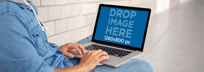 Mockup Featuring a Student Using a Macbook Pro at School 