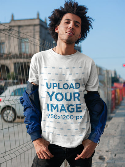 Mockup of a Man with a Coy Smile Wearing a T-Shirt