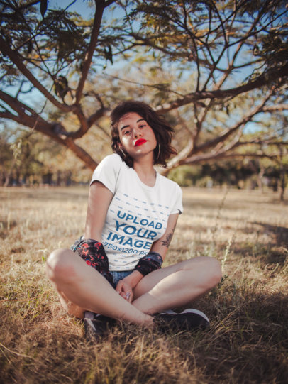 Mockup of an Attractive Woman Wearing a Tee in the Countryside
